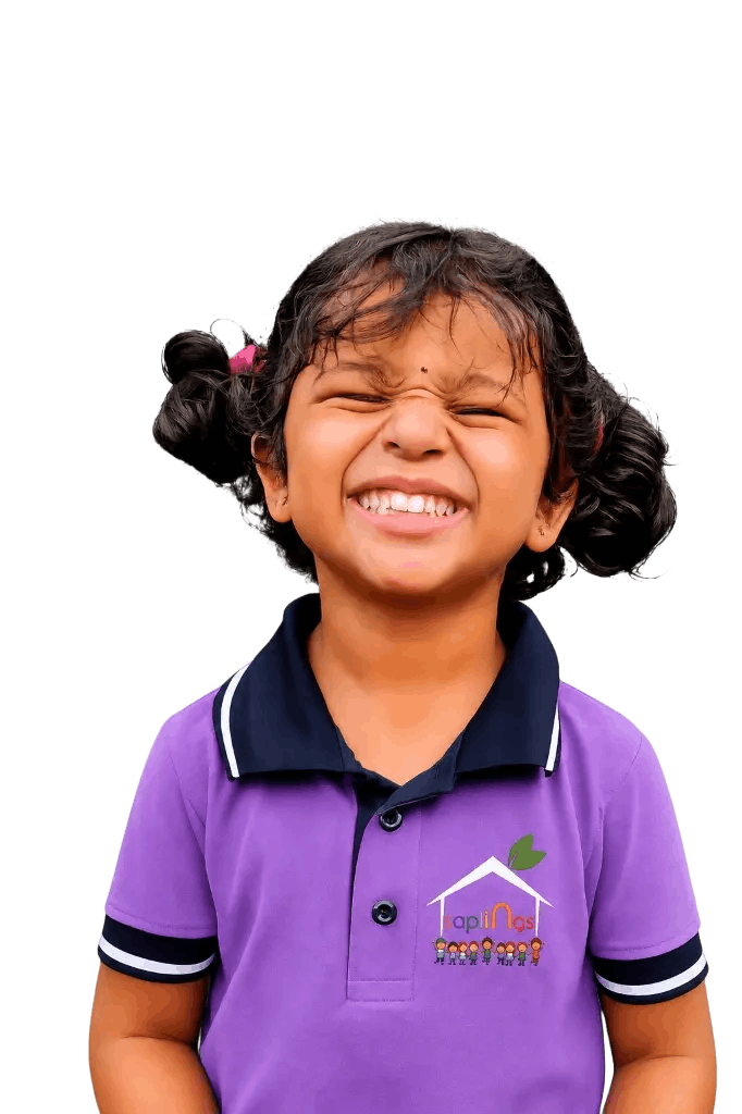 Happy smiling Saplings student in purple uniform